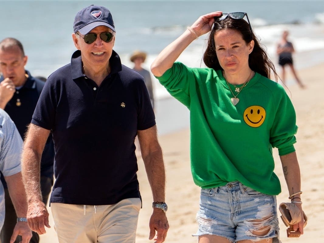 President Joe Biden walks on the beach with daughter Ashley Biden, in Rehoboth Beach, Del., June 20, 2022. Two people have pleaded guilty in a scheme to peddle a diary and other items belonging to Ashley Biden to the conservative group Project Veritas.