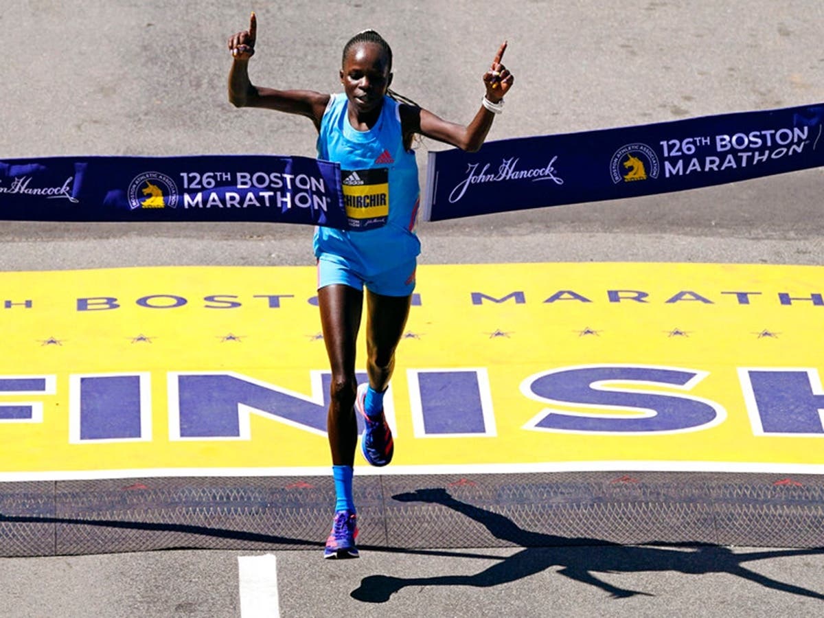 Peres Jepchirchir, of Kenya, crosses the finish line to win the women's division of the 126th Boston Marathon, Monday, April 18, 2022, in Boston. 