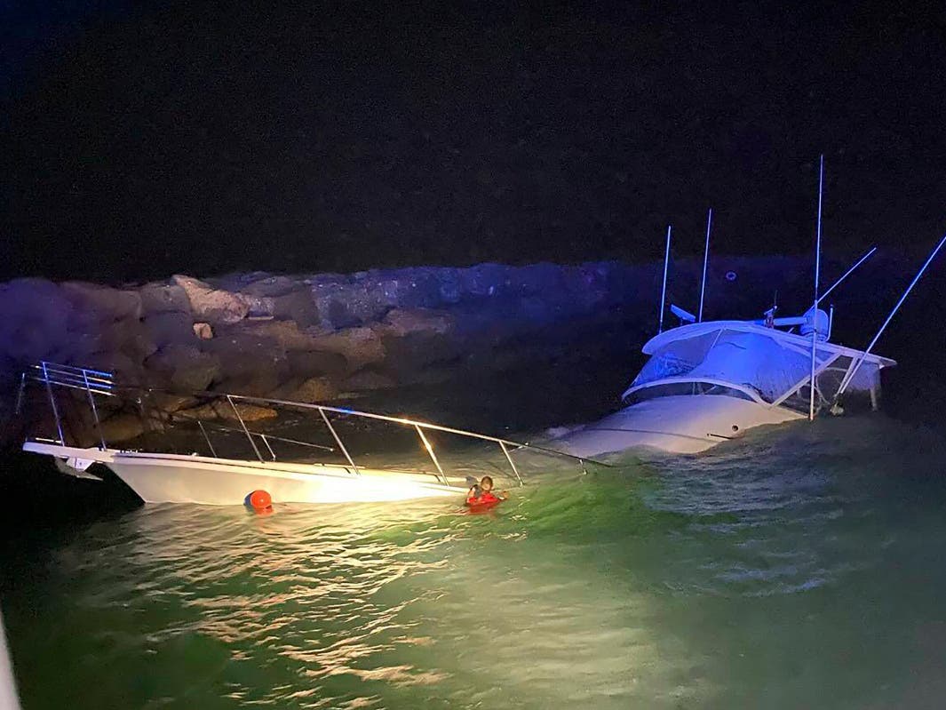 This photo provided by the Long Beach, Calif., Fire Department shows a power boat that crashed into a jetty in Southern California on Wednesday, July 3, 2024, killing one man and injuring 10 other people, officials said.