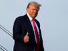 Former President Donald Trump steps off his plane as he arrives at Hartsfield-Jackson Atlanta International Airport, Thursday, Aug. 24, 2023, in Atlanta. Trump is headed to the Fulton County Jail.