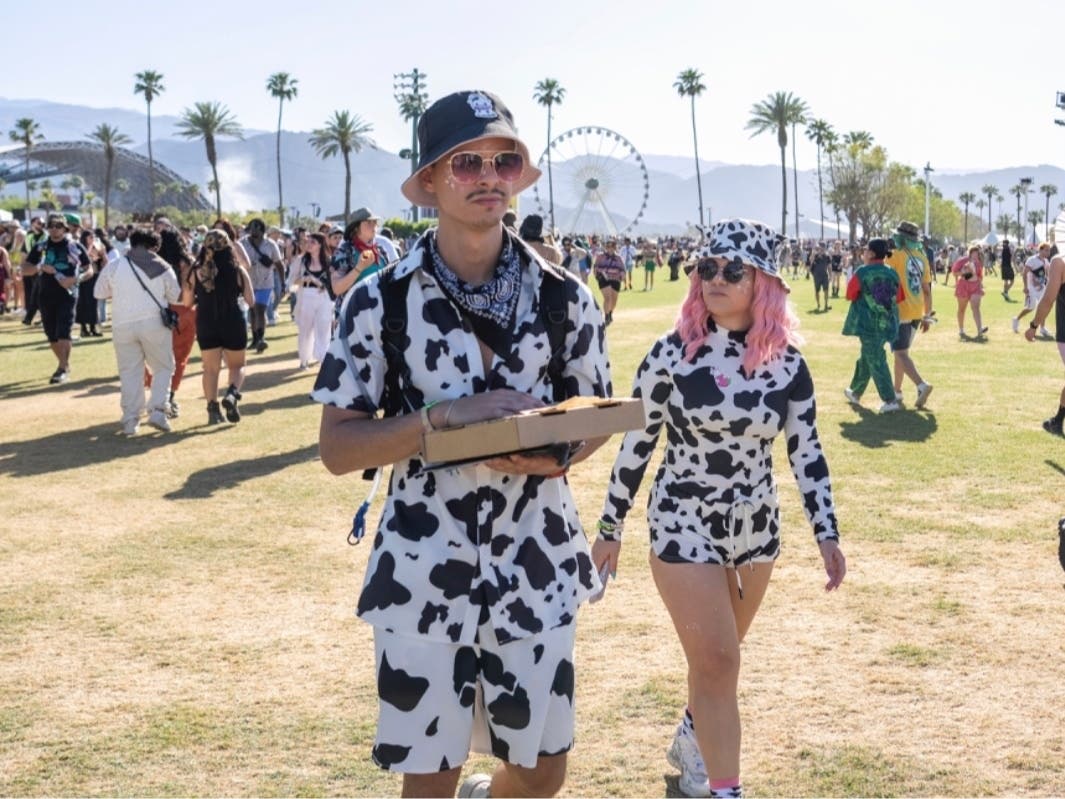 The pizza box carried by this bovine-inspired Coachella attendee probably contains spicy pie. The only way to enjoy the festival's cult-favorite slice is at the Empire Polo Club — but plenty of other Coachella food picks are available nationwide.