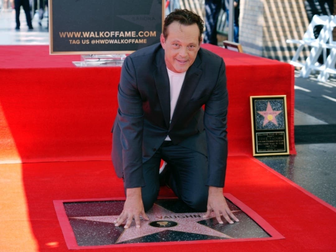 Actor Vince Vaughn poses atop his new star on the Hollywood Walk of Fame during a ceremony for him, Monday, Aug. 12, 2024, in Los Angeles.