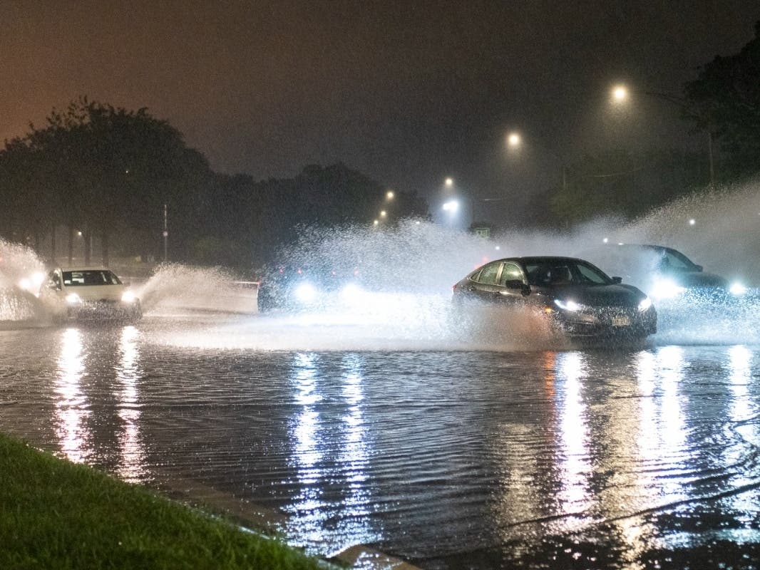 Vehicles make their way through a flooded section of DuSable Lake Shore Drive after a second severe storm raged through the Chicago area on Monday evening. 