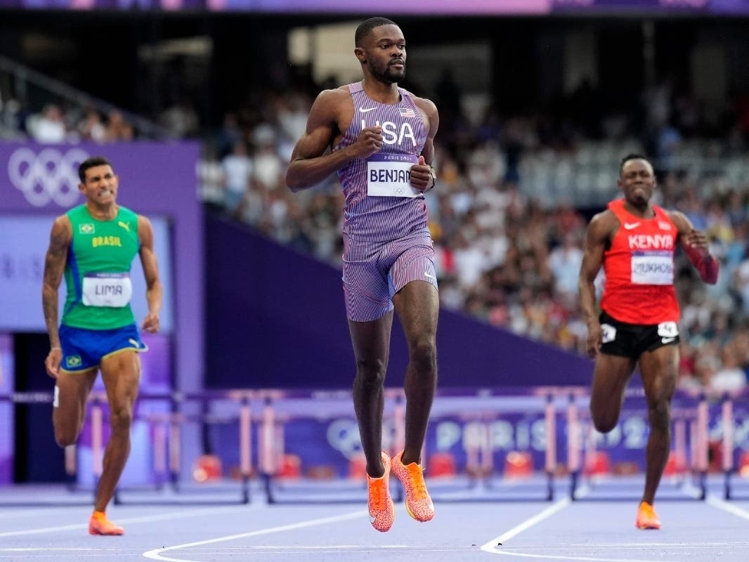 Rai Benjamin, centre, of the United States, competes in the men's 400-meter hurdles semifinal at the 2024 Summer Olympics, Wednesday, Aug. 7, 2024, in Saint-Denis, France. 