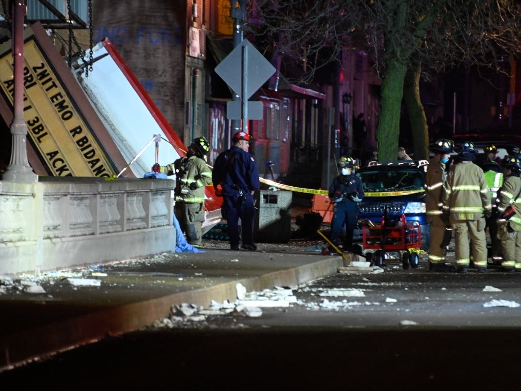 Authorities work the scene at the Apollo Theatre after a severe spring storm caused damage and injuries during a concert, late Friday in Belvidere. The roof collapse was first reported at 7:48 p.m. as fast-moving storms moved through the area.