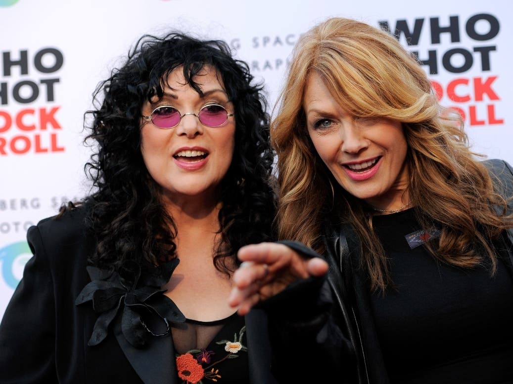 Ann Wilson, left, and her sister Nancy Wilson of the band Heart pose together at the "Who Shot Rock and Roll" photo exhibition opening at the Annenberg Space for Photography on Thursday June 21, 2012, in Los Angeles. 