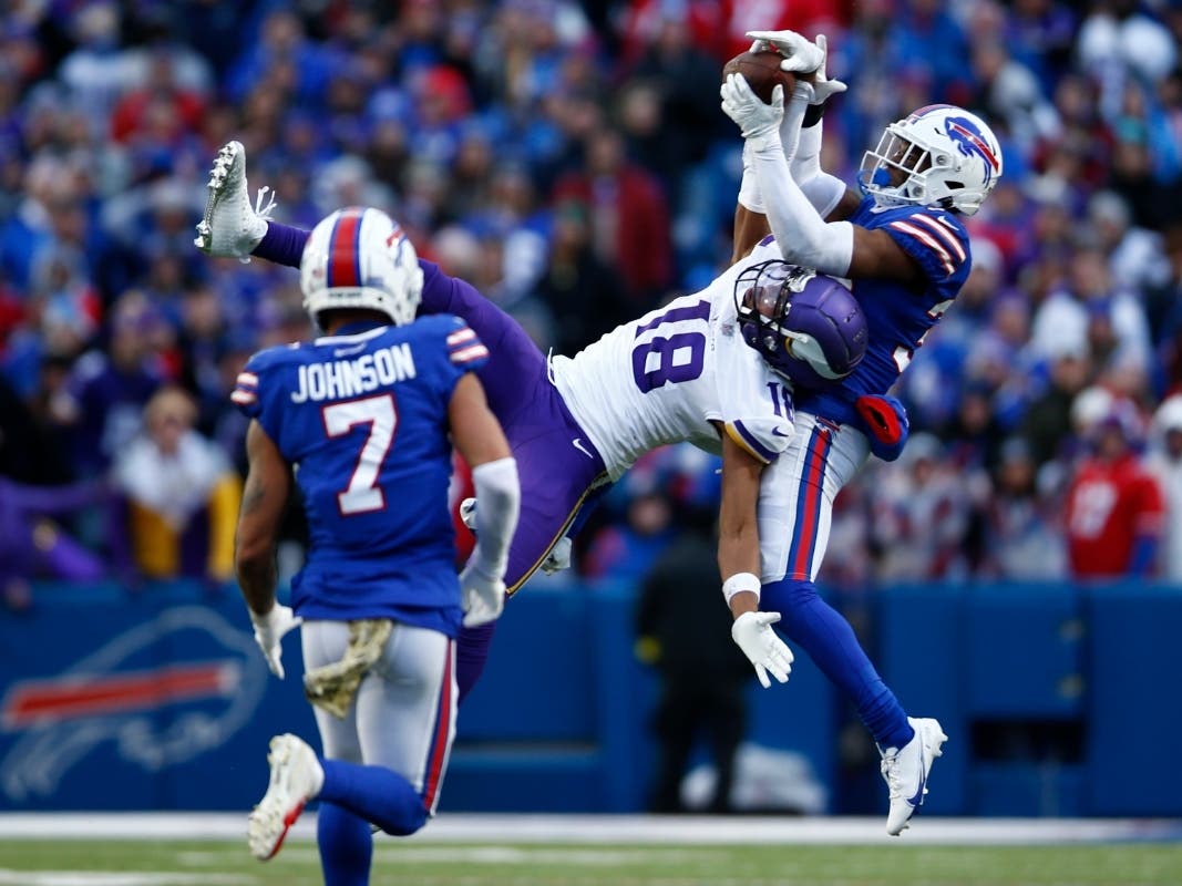 Justin Jefferson #18 of the Minnesota Vikings catches a pass in front of Cam Lewis #39 of the Buffalo Bills during the fourth quarter at Highmark Stadium on November 13, 2022 in Orchard Park, New York.