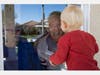 Mary-Lou McCullagh, 83, and her husband Bob, 84, greet Axel Stirton, 2, the little boy who lives across the street April 3, 2020 in Ventura, CA. Mary-Lou and Bob are in isolation, trying to ensure that they do not come in contact with the coronavirus.