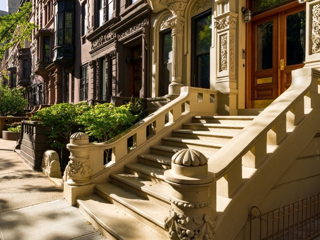 Upper West Side brownstones with doorsteps.