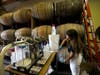 Ivana Kucan fills bottles with hand sanitizer at Old World Spirits on March 27 in Belmont, CA. With a shortage of hand sanitizer as COVID-19 spreads, Old World owner Davorin Kuchan converted his liquor distillery to produce hand sanitizer.