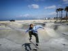 A lone skater sneaks in some practice at the skate park at shuttered Venice Beach amid the coronavirus pandemic on March 29, 2020 in Venice, California. Los Angeles County has closed all beaches as a measure to stem the spread of COVID-19. 