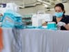 An employee from the Tieks by Gavrieli shoe company makes masks to be donated to hospitals amid the coronavirus pandemic on March 31, 2020 in Culver City, California. 