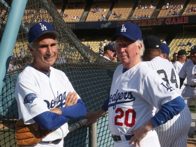 Former Los Angeles Dodgers Sandy Koufax (L) and Don Sutton talk as they gather with former the New York Yankees for an Old Timers game before the game between the Atlanta Braves and the Los Angeles Dodgers at Dodger Stadium on June 8, 2013 in Los Angeles.