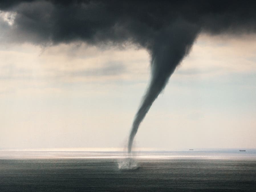 Several beachgoers in Destin captured a massive waterspout off the Florida coast on video.