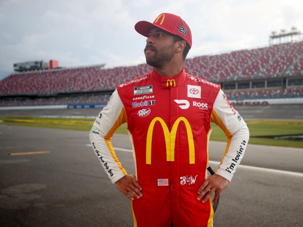 NASCAR Cup Series YellaWood 500 winner Bubba Wallace walks the field in Alabama. 