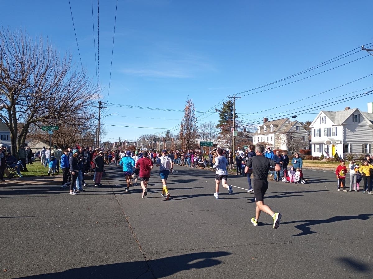 The Mile 4 funnel is one of the loudest and most inspiring portions of the annual Manchester Road Race, staged every Thanksgiving Day for the past 87 years.  