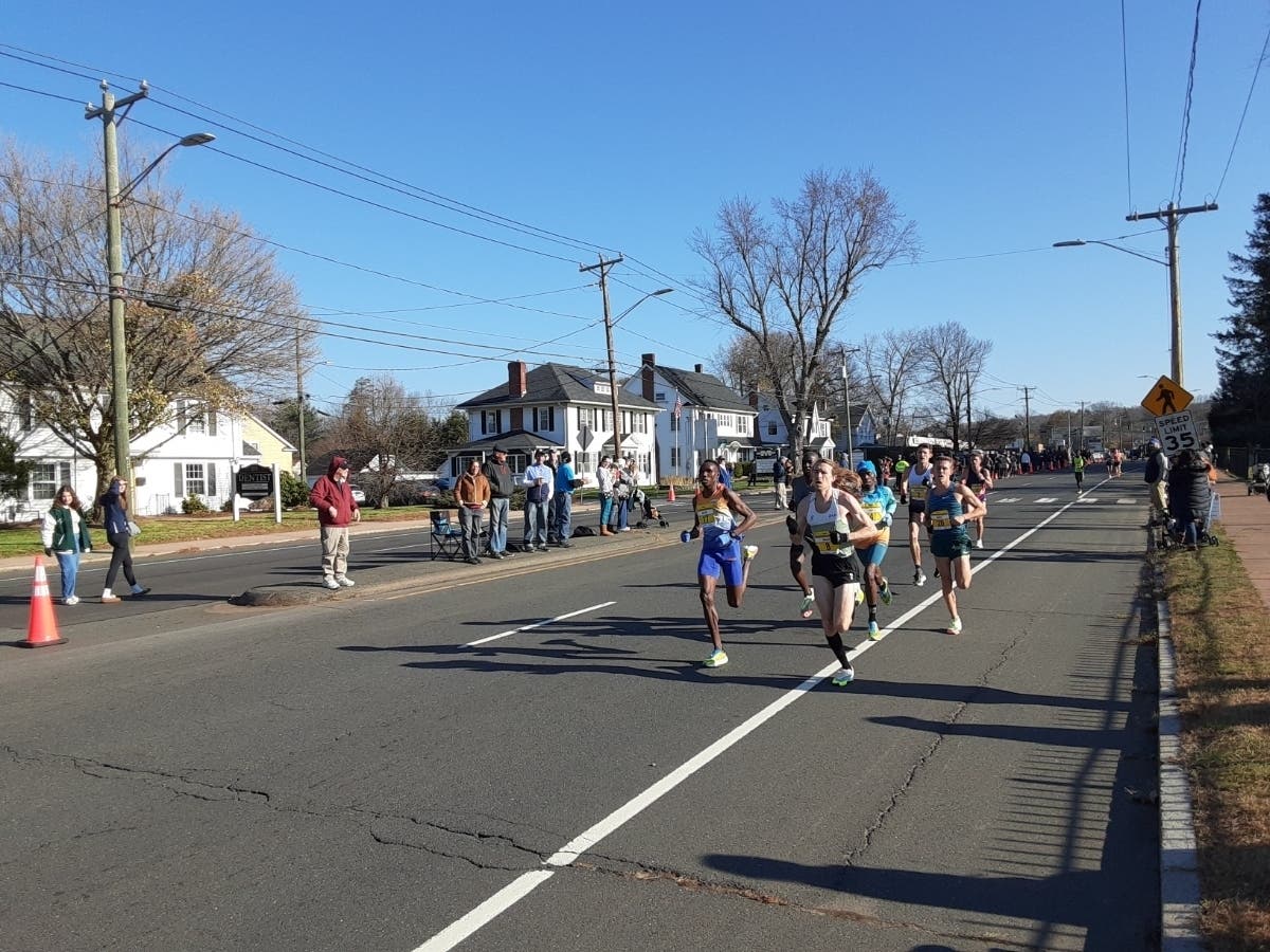 Conner Mantz, the US Marathon Trials champ, leads the pack in a past Manchester Road Race. He will be one of 14 MRR alumni running in the Paris Olympics.  