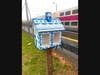 The newly rebuilt and repainted Little Library, featuring the blue and white designs from the historic Dedham Pottery, is now back in action as a free, neighborhood lending library located at the Corporate MBTA Commuter Rail Station on Rustcraft Road.