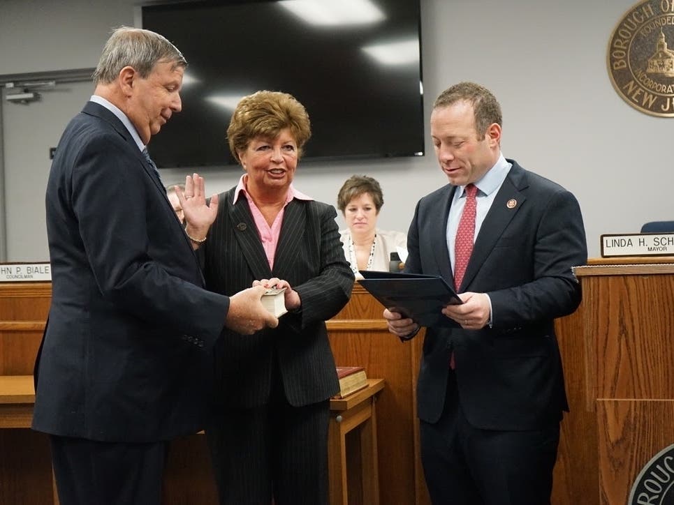 Rep. Josh Gottheimer administer the oath of office to Oakland Mayor Linda Schwager at the borough's annual reorganization meeting Sunday.
