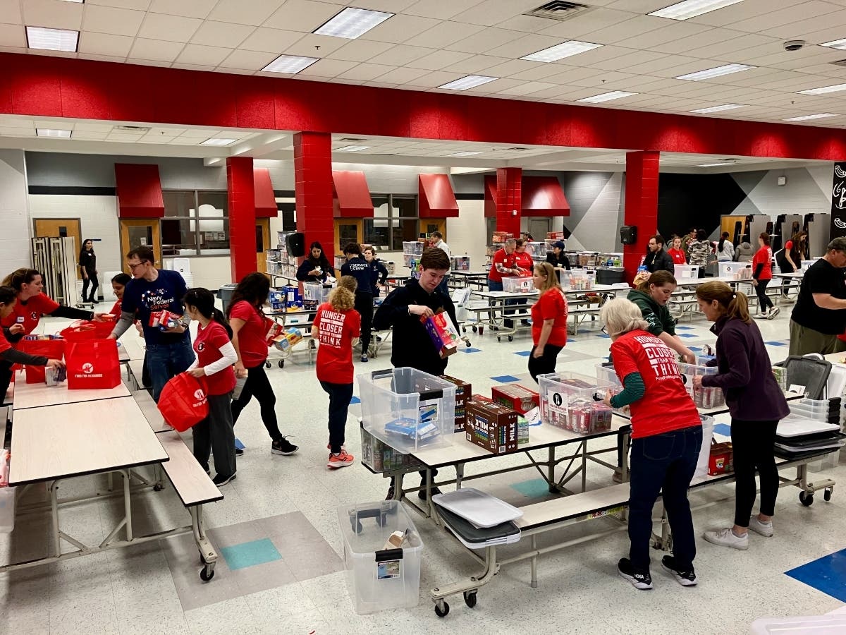 Community members in the Reston and Herndon area come together to receive and sort thousands of pounds of food for students in need.