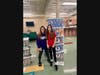 Two young volunteers "measure up" to a job well done. Sorting food and toiletries at Crossroads United Methodist Church is fun!