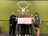 Also owned by Samrina Islam is CrossFit Fairfax, where FFN Founder Karen Joseph (right center) celebrated with Head Coach Julie Furneisen (left center), No Child Goes Hungry Founder Rev. Kären Rasmussen (back center), and other dedicated CrossFitters.