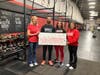 Food For Neighbors (FFN) celebrates its new partnership with CrossFit Reston, now owned and run by Samrina Islam and her family. Pictured R-L are Samrina Islam, daughter Jennah Whitehill, and  brother Shakil Islam with FFN Founder Karen Joseph.

