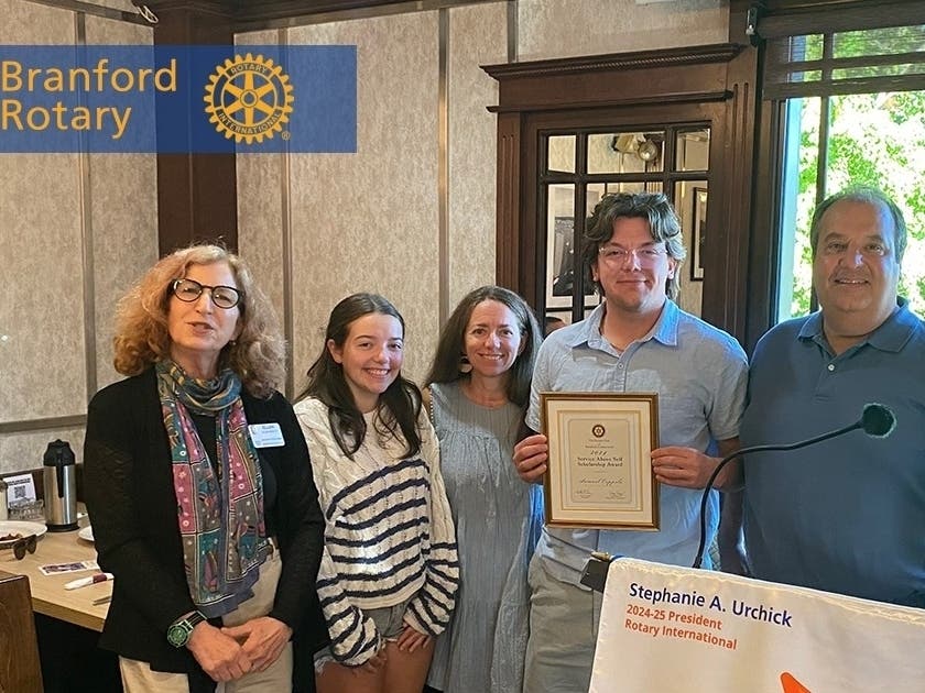 Sam Coppola flanked by (R-L) his father Mark, his mother Christine, his sister Lily, and Branford Rotary President Ellen Carucci.