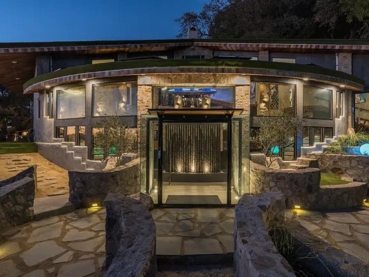 This Napa mansion channels Frank Lloyd Wright with earthy materials and fluid design.