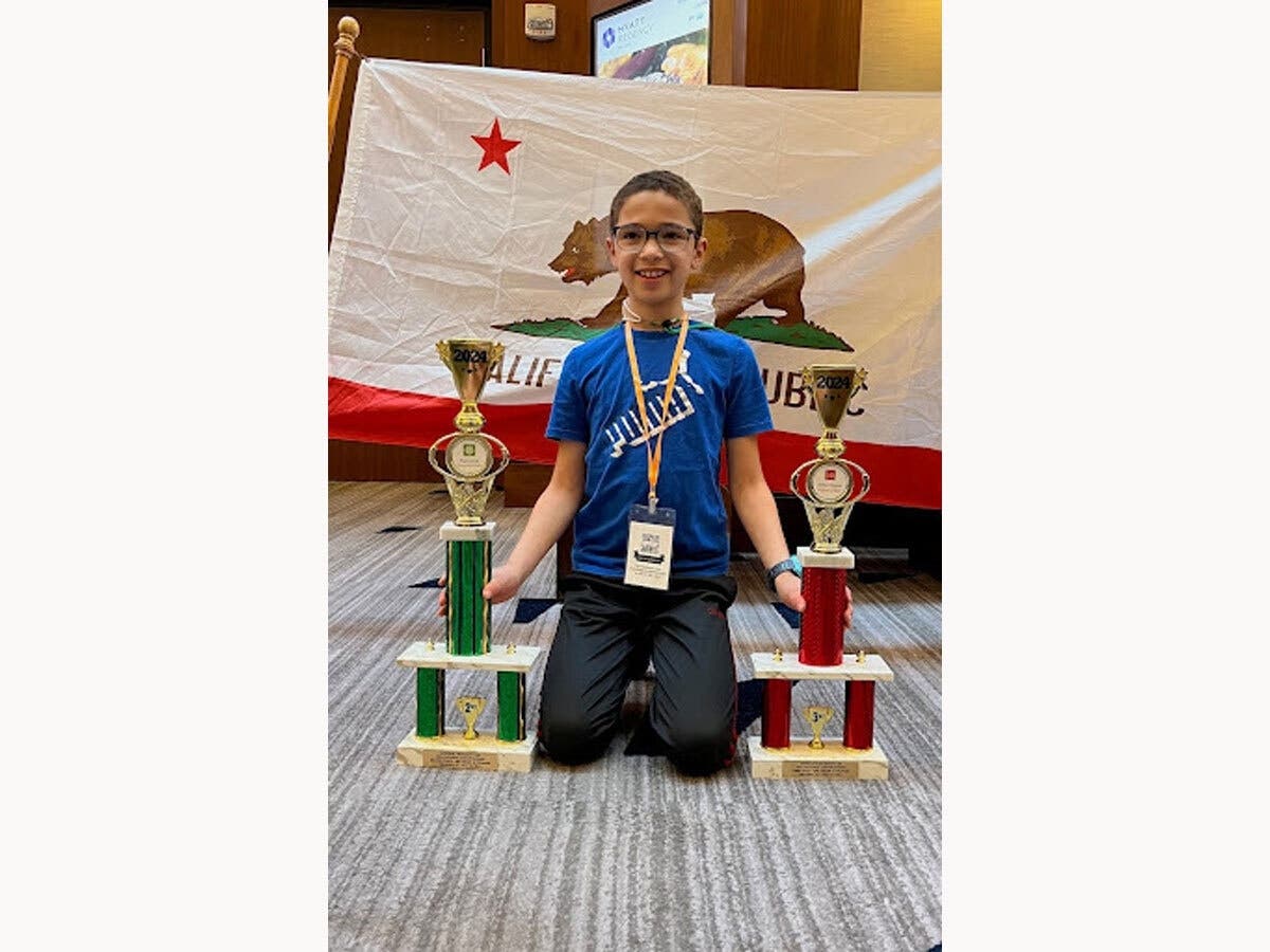 Cristian with two of his trophies.