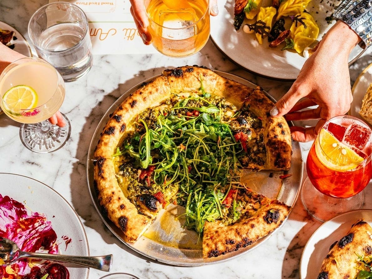 Molti Amici serves wood-fired pizzas that "are ideally blistered and feature simple but compelling toppings."