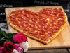 Pizza Guys locales are bring back their heart-shaped pizza for the month of February.