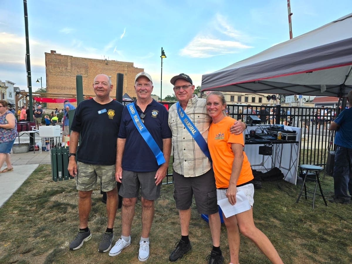 Pictured left to right: Rick Leadley and John Miller of the Lemont Lions Club, John Quinn, and Tricia O'Neill, President of the Lemont Keepataw Day organization.