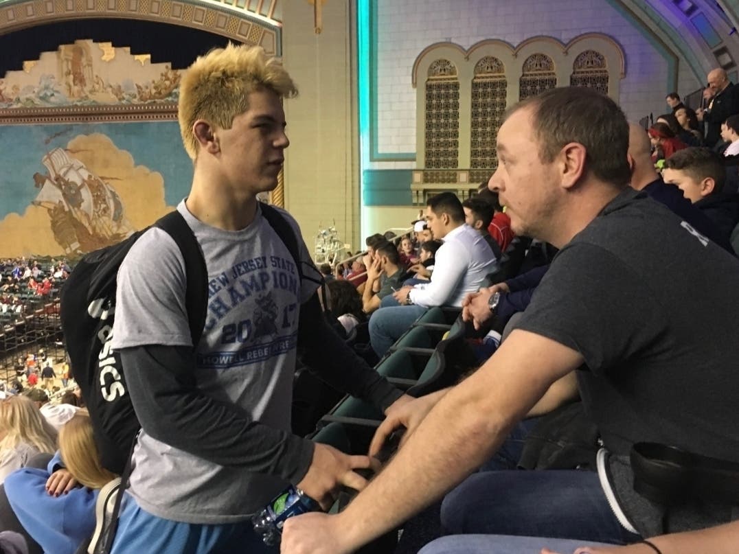 Shane Reitsma speaks with his uncle, Walter Reitsma, during the NJSIAA Wrestling tournament in Atlantic City in March 2017.