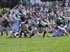 Brick's Tyler Weisneck (center) rushes the ball in the first half. He scored two touchdowns in the second half. 