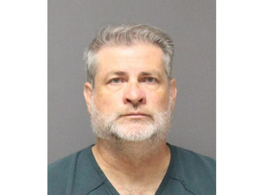 Douglas J. Bollinger is accused of criminal sexual contact with the student in Point Pleasant Beach and Asbury Park, the prosecutor's office said.