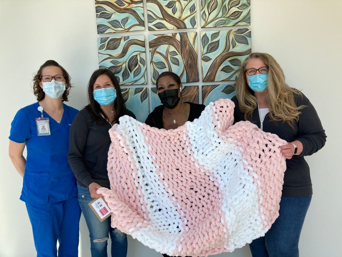 AR Workshop Gives Handmade Blankets To Norma Pfriem Breast Center