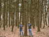 Joel Dickstein (left), and Liran Kapoano (right), of DK Solutions pose in a pine grove near the company headquarters in East Brunswick, NJ in 2022. Since then, DK Solutions has funded the planting of over 7,000 trees in Montana, Wyoming, and now, Hawaii.