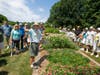 Visitors taking a guided tour of the Rutgers Gardens.