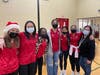 Ruby Martinez (right), a masseuse at the Y, brought members of her daughter’s FC Hawks Soccer Team to volunteer at the Blessing Bags Packing Event.  