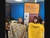 Cara Wetter (left) and Lia Soristo, both age 9, show off their handmade blankets at the NSYMCA’s pet blanket making event for local shelters.