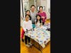 The Yau Family including 9 year-old Sahana (front left), 10 year-old Katelyn, and 8 year-old Hannah share family time with their parents at the Y’s pet blanket making event.