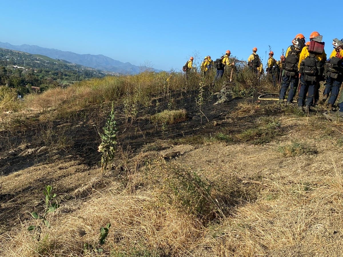 Firefighters observing the scene at the San Juan Capistrano area fires, Tuesday night. "We remind everyone to stay vigilant and help prevent fires. Your cooperation is crucial in keeping our community safe."