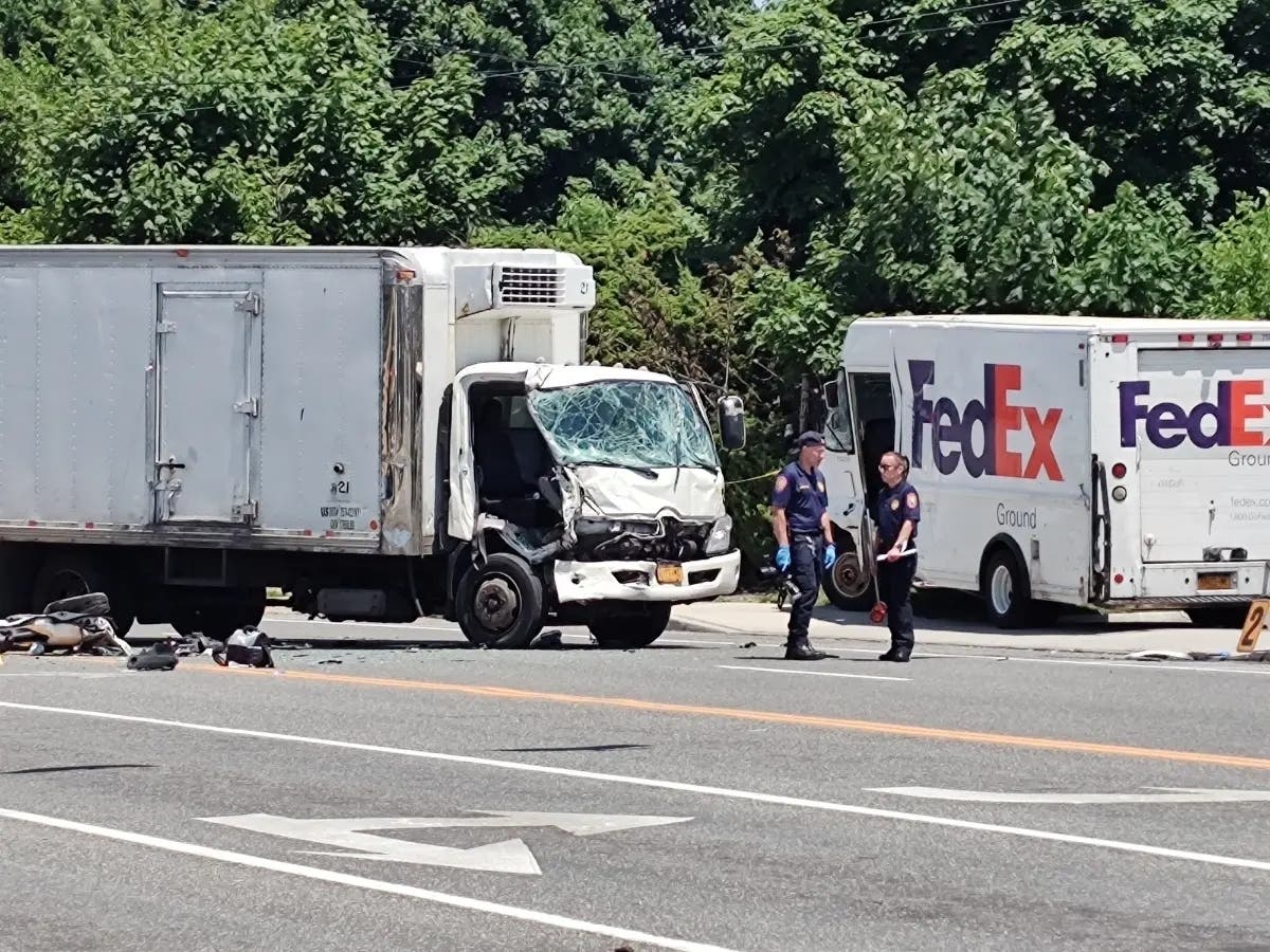 One person is dead following a crash between a FedEx truck and a box truck in Levittown on the morning of June 15. 