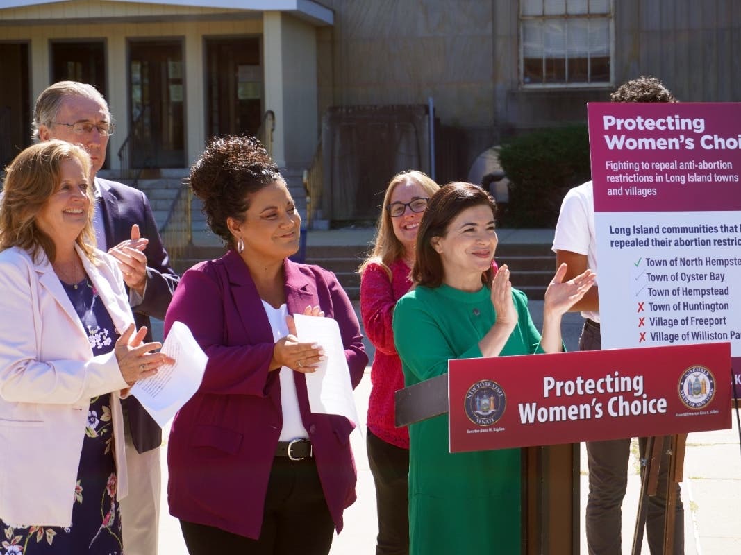 Assemblywoman Judy Griffin, left, Senator Jim Gaughran, Assemblywoman Gina Sillitti, Jennifer Eramo (Planned Parenthood of Greater New York) and Senator Anna M. Kaplan celebrate the repeal of local abortion restrictions following their calls to do so.