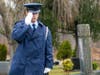 Cadet First Lieutenant Steven Johnston salutes after placing a wreath on a veterans grave in the Raymond Hill Cemetery on Wreaths Across America Day. 