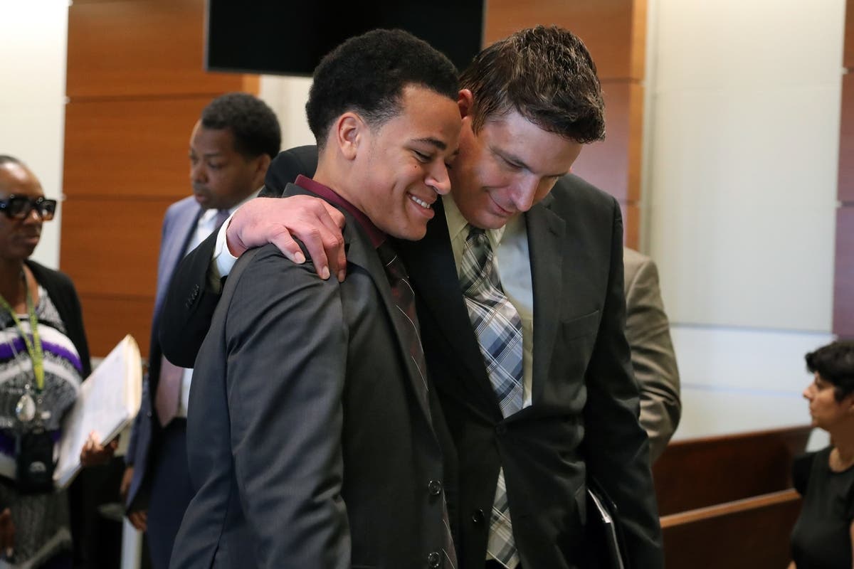 Zachary Cruz (left) is embraced by Mike Donovan, CEO of Nexus Services, Inc., after Cruz was granted the ability to move to Virginia in May. Cruz is the brother of the accused Marjory Stoneman Douglas High School gunman.