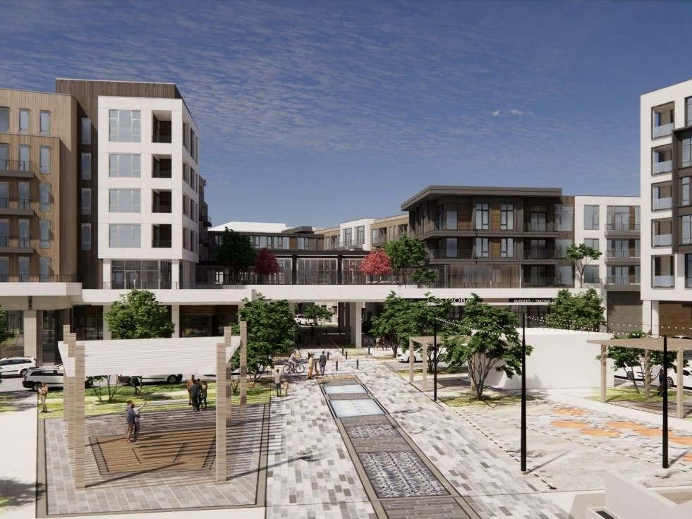 A rendering shows a view over a common area nd event space toward a 5-story and 7-story connected apartment building with up to 425 units planned as part of the first phase of Old Orchard mall redevelopment.