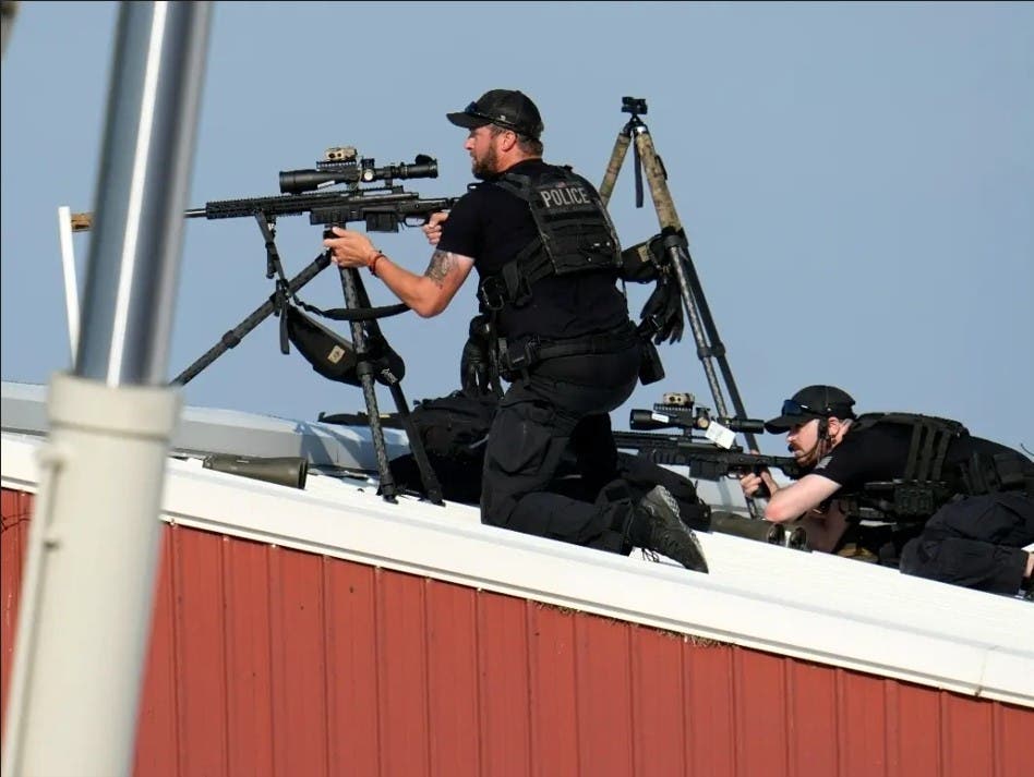 Police snipers return fire after shots were fired while Republican presidential candidate former President Donald Trump was speaking at a campaign event in Butler, PA.