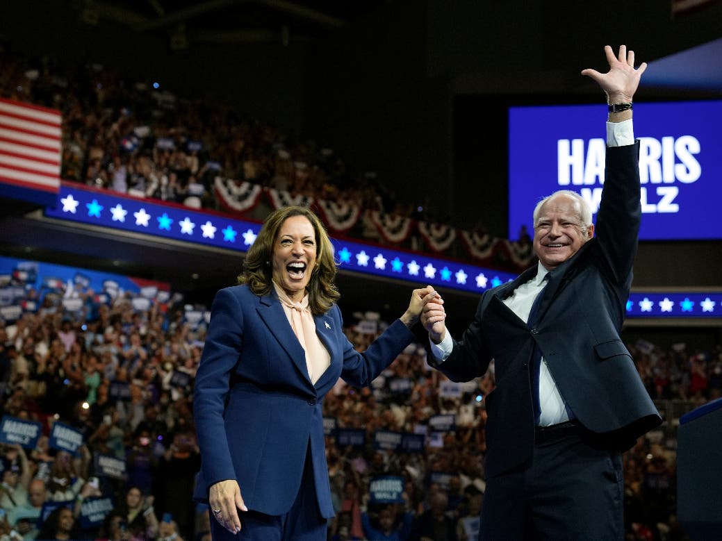 Democratic presidential nominee Vice President Kamala Harris accompanied, left, by her running mate Minnesota Gov. Tim Walz, appear at a campaign event in Philadelphia, Aug. 6, 2024. 